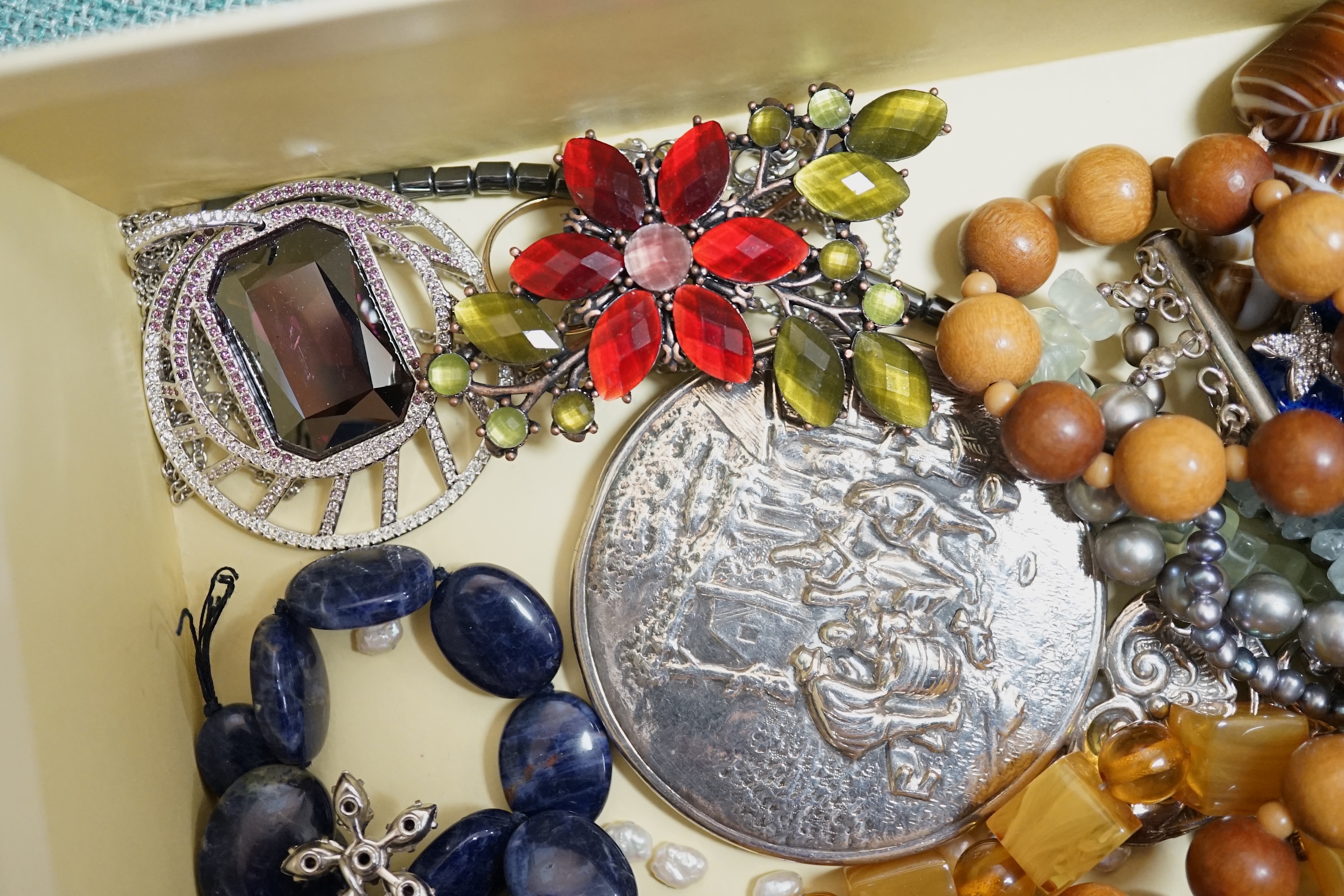 A quantity of assorted costume jewellery. Condition - poor to fair to good